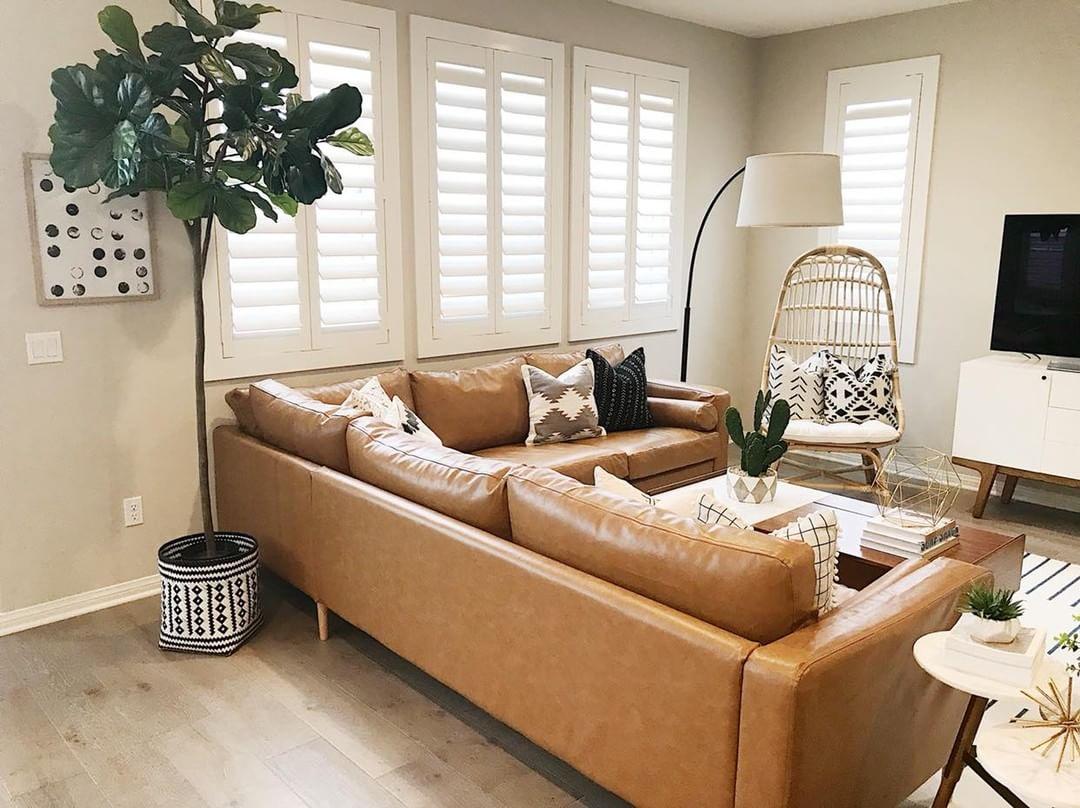 Warm living room with Polywood shutters in Chicago.